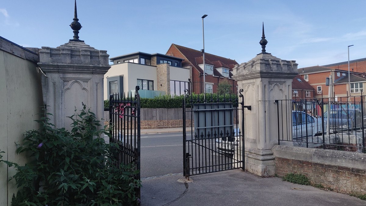 Stone gate piers at a cemetery entrance